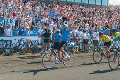 A Phi Delta Theta Little 500 rider celebrates while crossing the finish line.
